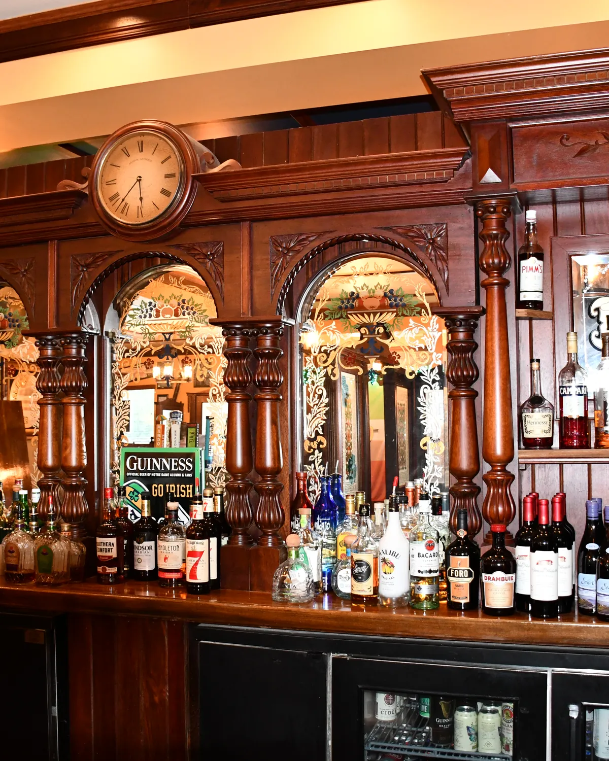 Carved wood, etched mirrors, and bottles on the Brazen Head back bar